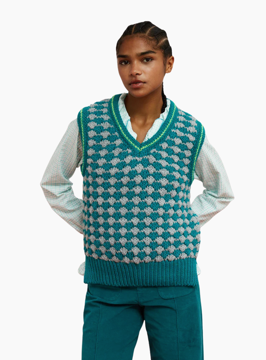 Chaleco Crisscross turquesa de Dr. Bloom con textura nido de abeja y detalle neón