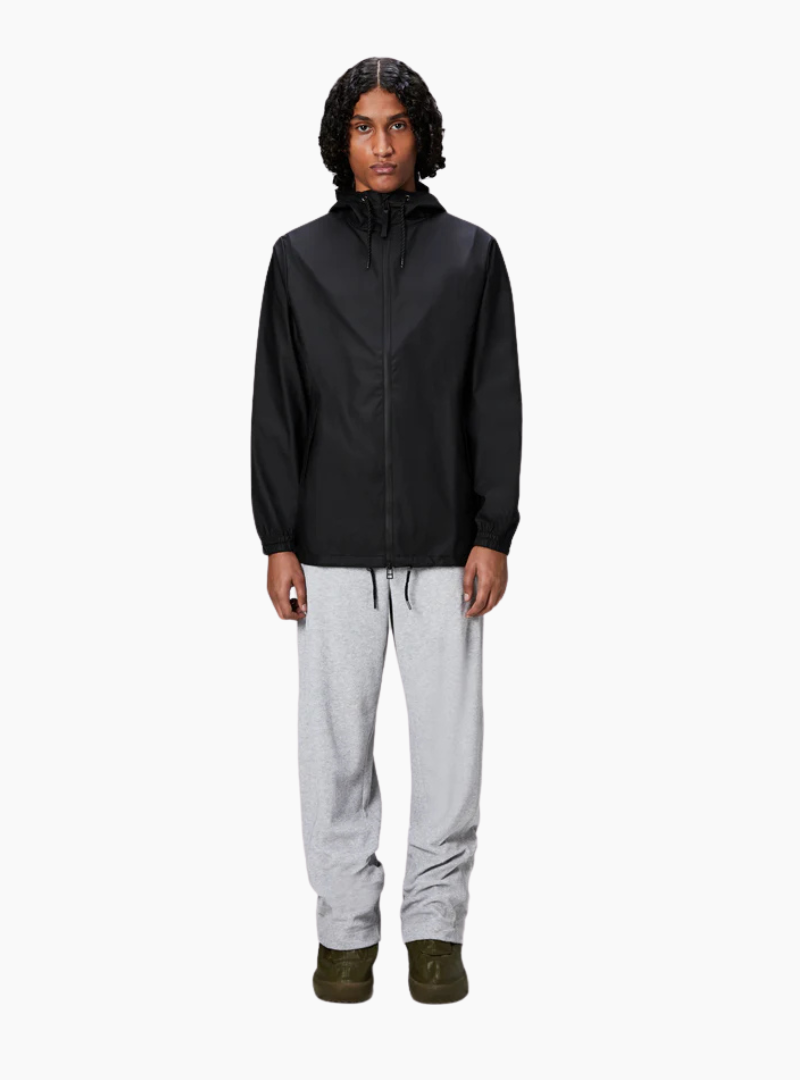 Chubasquero Rains Storm Breaker negro unisex, W3 5000 mm, capucha con visera y cremallera bidireccional