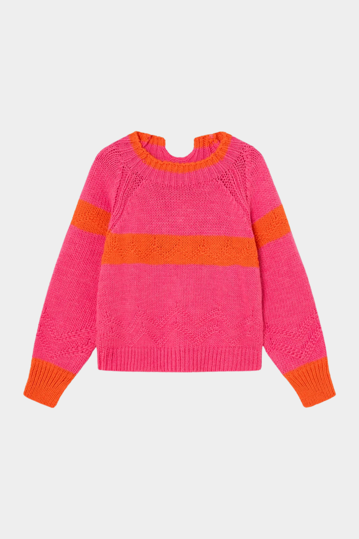 Jersey Caramelo Rosa de Dr Bloom puesto en mujer con corte relajado, manga raglán y contraste naranja