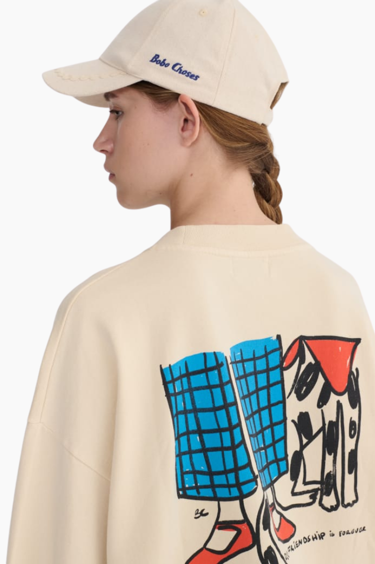 Sudadera Bobo Choses Dog Friendship blanca con gráfico de chica y perro