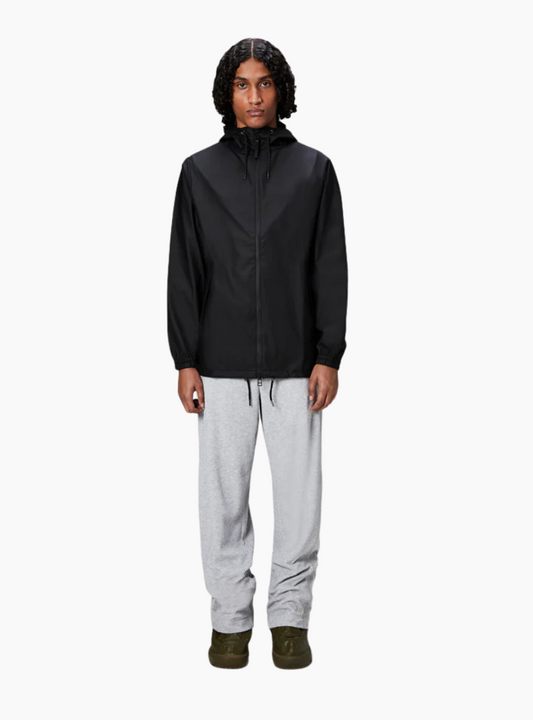 Chubasquero Rains Storm Breaker negro unisex, W3 5000 mm, capucha con visera y cremallera bidireccional