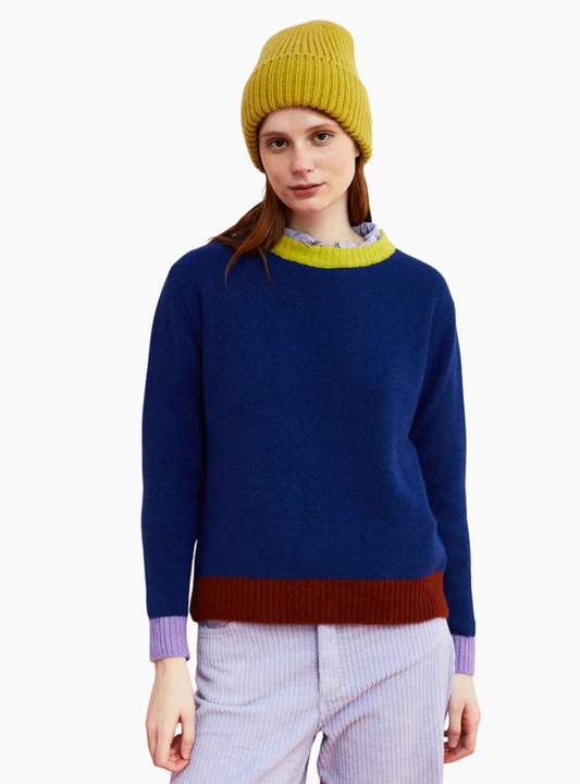 jersey Moss azul de Dr. Bloom con cuello amarillo, puños lilas y bajo marrón